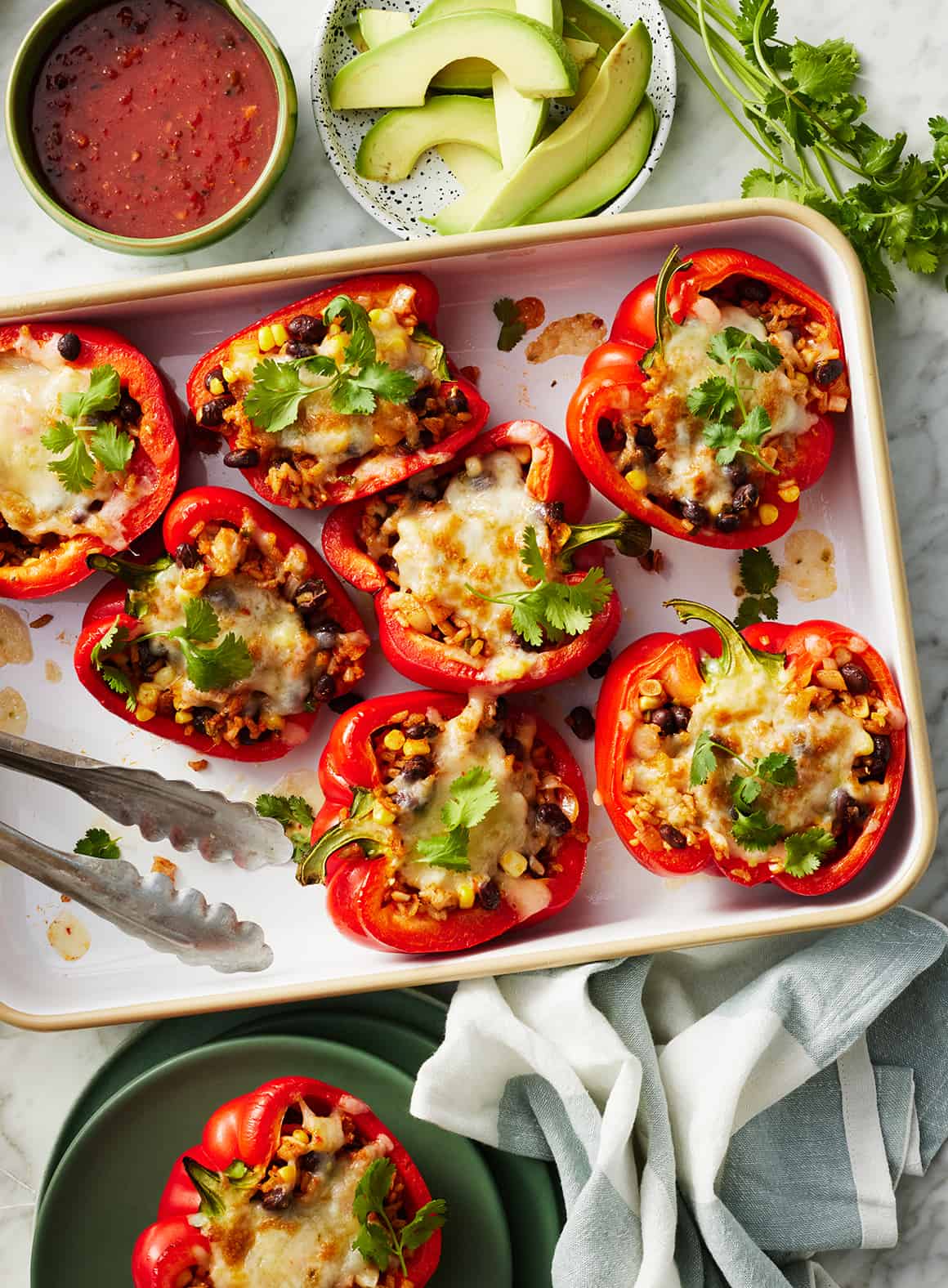 Vegetarian stuffed peppers on a baking sheet